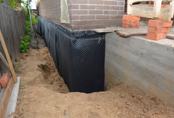 SJ Waterproofing Pros technician performing targeted Emergency Waterproofing assessment in Rothbury, MI